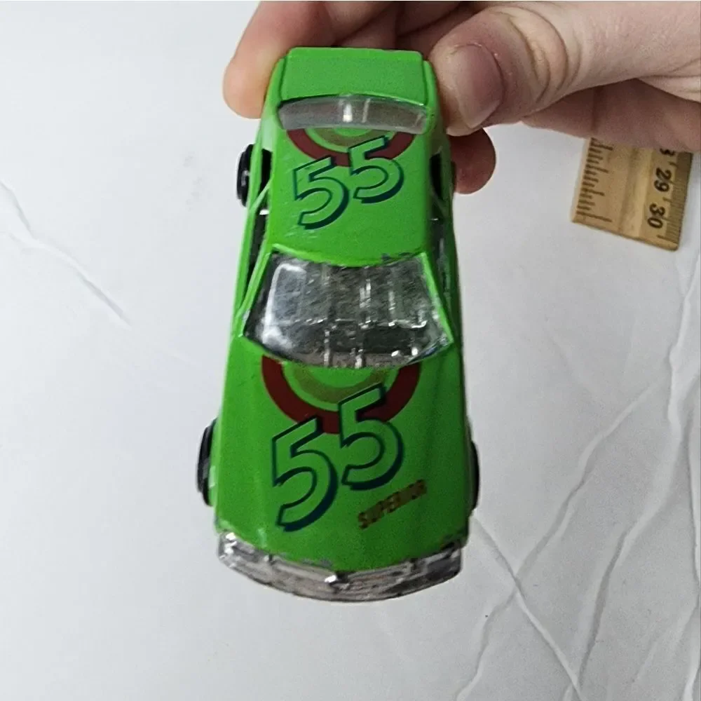 MERCEDES-BENZ 500 SEC  number 8803 can be found on inside Green Race Car #55